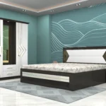 Modern-bedroom-set-with-bold-linear-accents-featuring-a-cushioned-bed-sleek-wardrobe-with-mirror-and-matching-side-table-scaled.webp